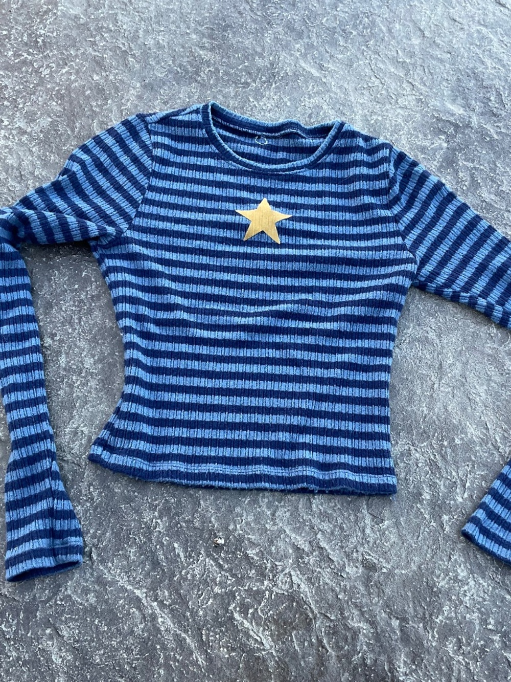 Blue striped long sleeve shirt with star emblem